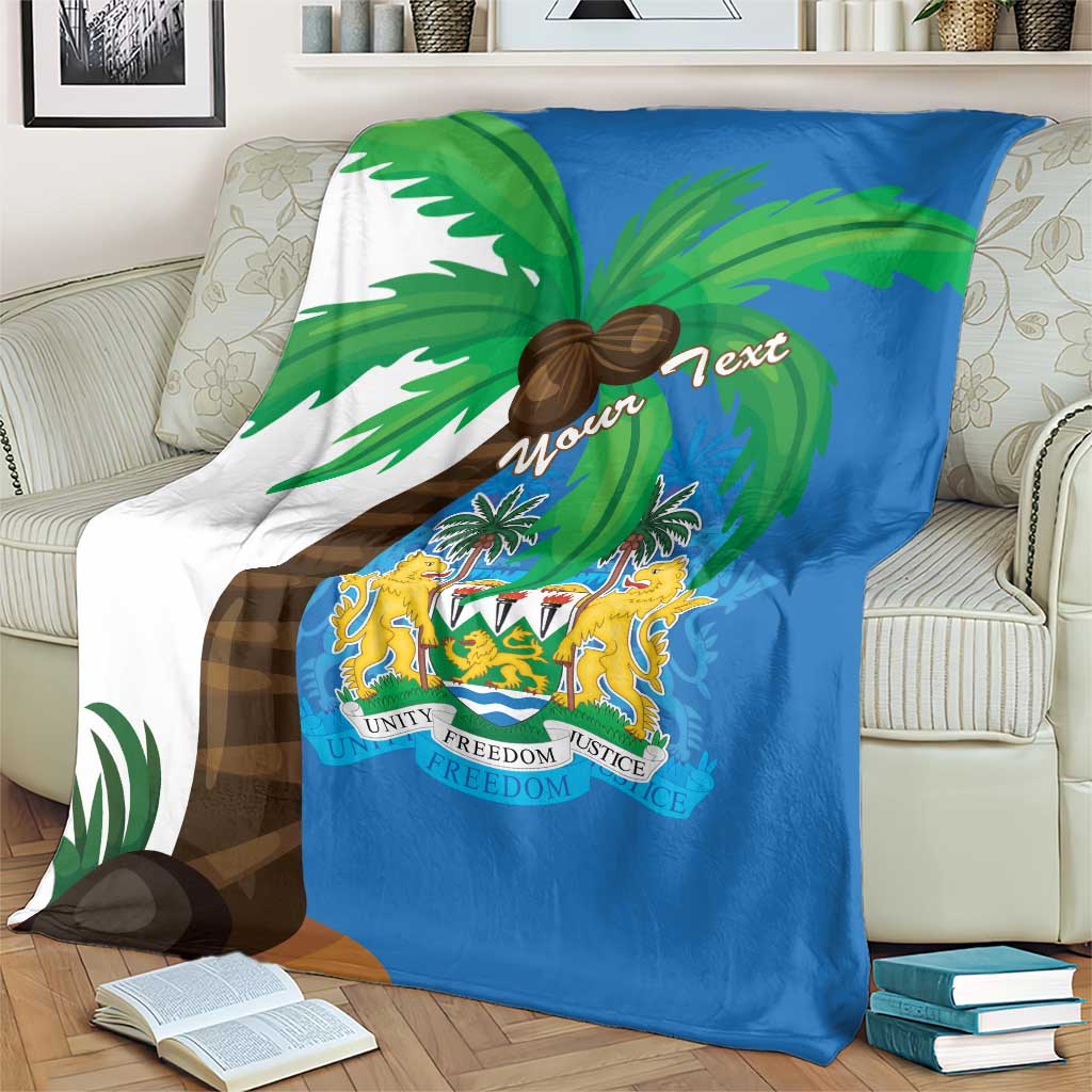 Blue blanket coat with white side panel, palm trees, and crest shield graphic