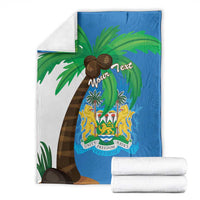 Blue Sierra Leone flag blanket coat with palm tree graphic and crest shield, with folded pieces