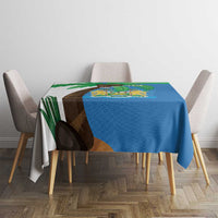 Blue tablecloth on table with Sierra Leone coat of arms and flag map across center