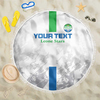 White round football beach blanket with fringe, green/blue stripes and Leone Stars print