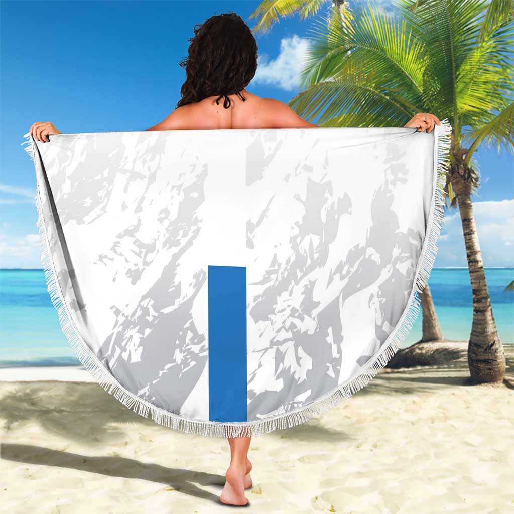 White round beach blanket with fringe, green/blue stripes and Leone Stars print, held open