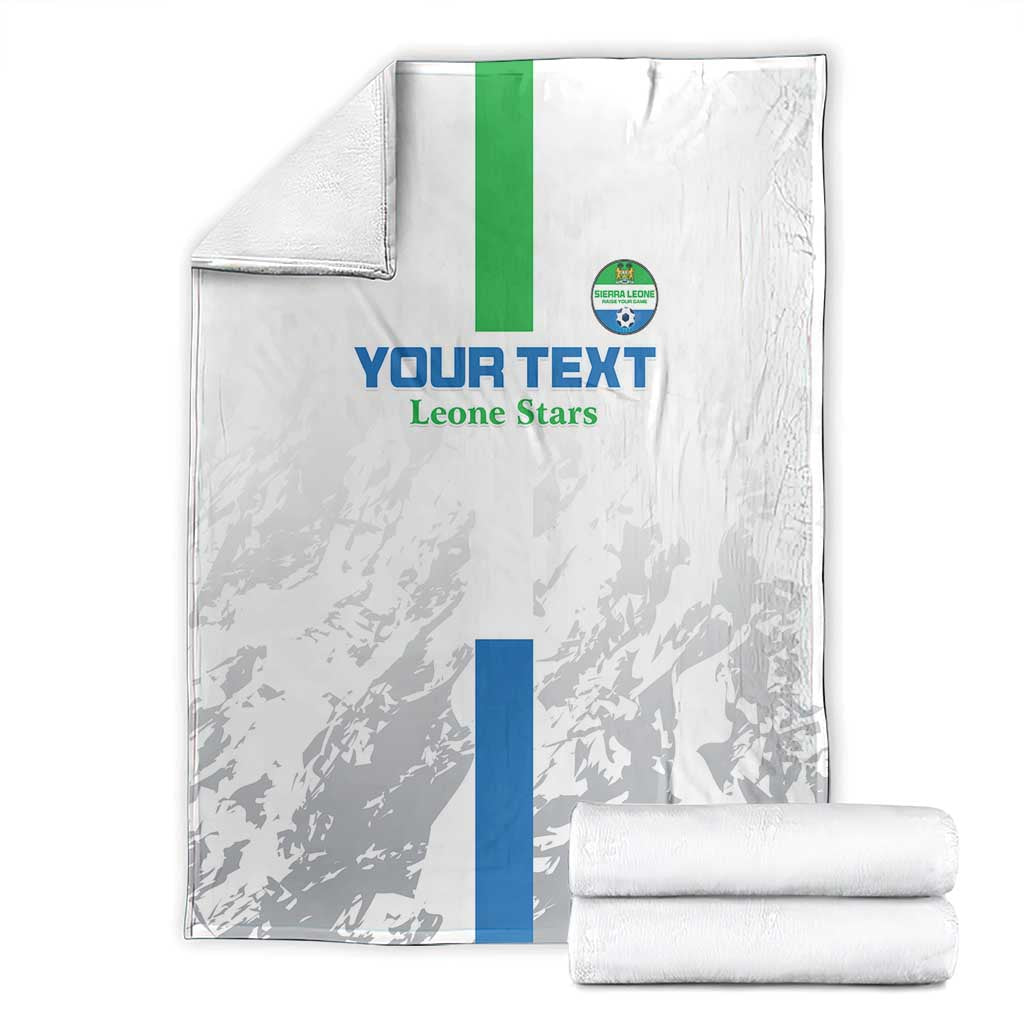 Football blanket set: white and gray blanket with green stripe, blue panel, and crest