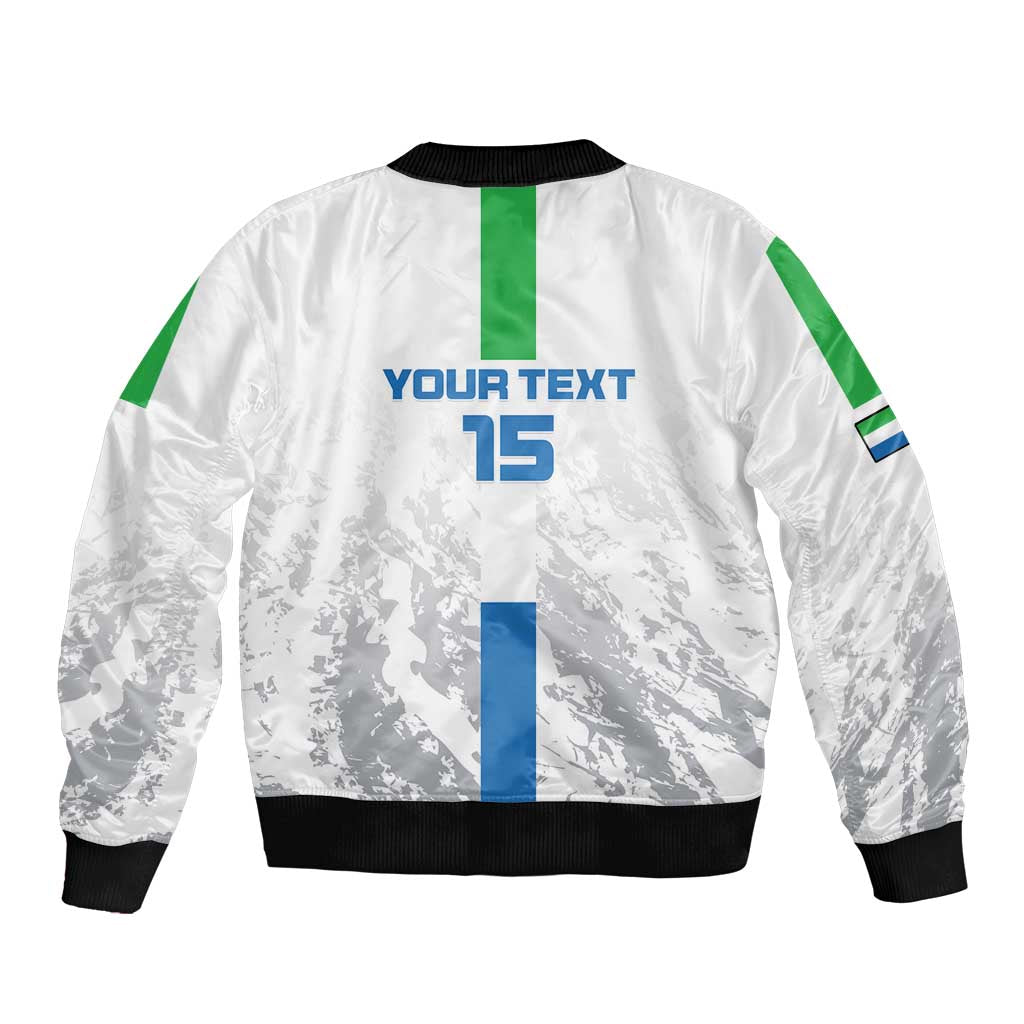 White bomber jacket back with custom text and blue 15, green sleeve stripes, black ribbing