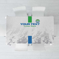 White football tablecloth with green emblem and “Leone Stars” text, folded with clips