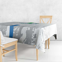 Gray football tablecloth with blue stripe and player silhouette print over outdoor table