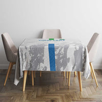 Gray football tablecloth with blue center stripe and player silhouette print on dining table