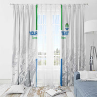 White football window curtain with custom blue and green lettering across gray patterned fabric