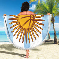 Round basketball beach blanket with fringe, custom text sunburst print, held out on sand