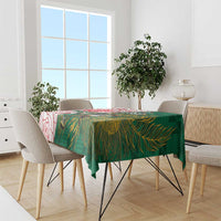 Green tablecloth with rugby mascot and leaf-pattern print, draped on dining table