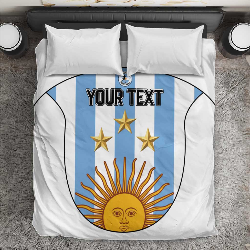 White duvet cover and pillowcases with blue crest and golden sun graphic
