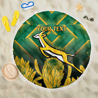 Green round beach blanket with white fringe, kangaroo graphic and custom text