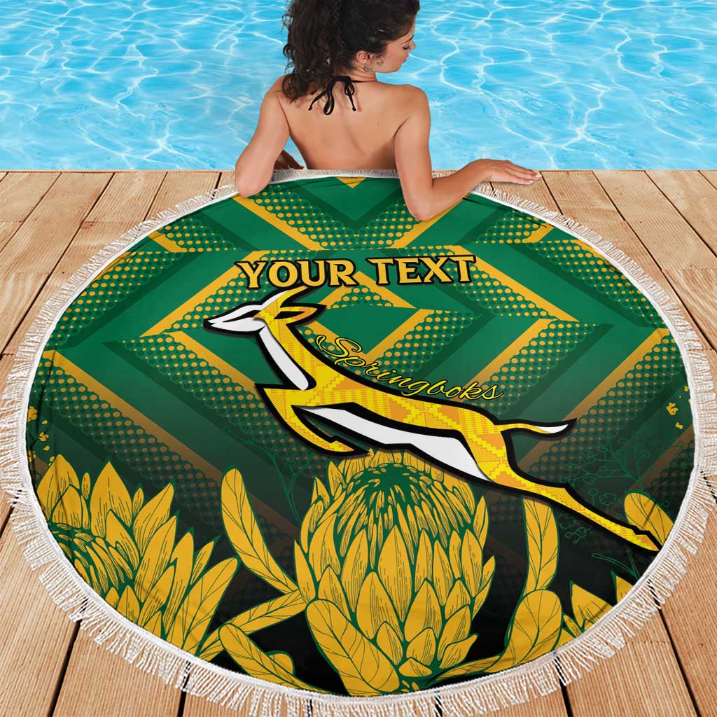 Round green beach blanket with white fringe, kangaroo graphic and custom text on deck