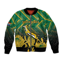 Green zip-up bomber jacket with black sleeves, South Africa crest and gold protea graphic