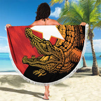 Round beach blanket held outdoors, fringed edge, red/black 40th Independence Day crocodile