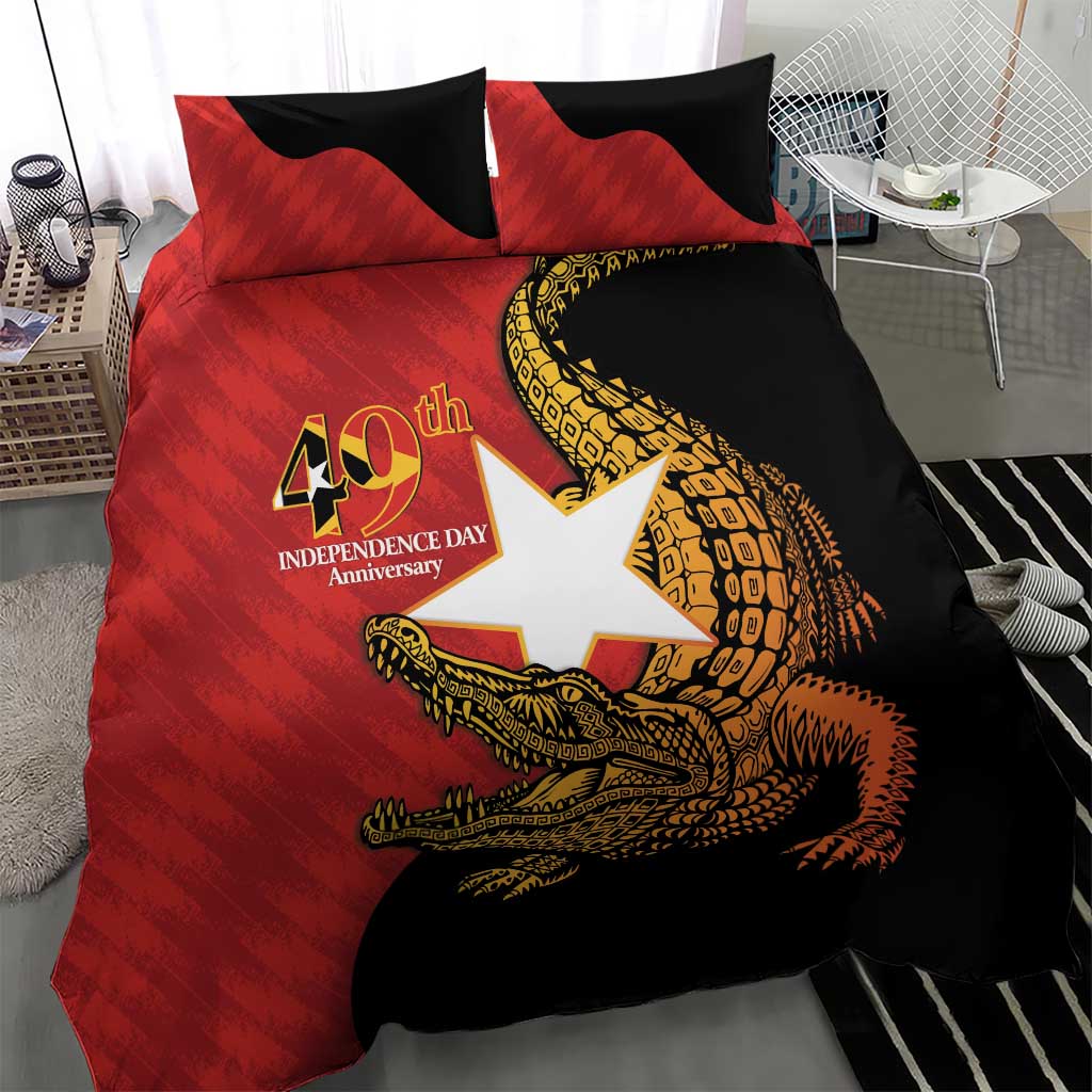Red and black duvet cover set with crocodile emblem and two pillow shams on bed