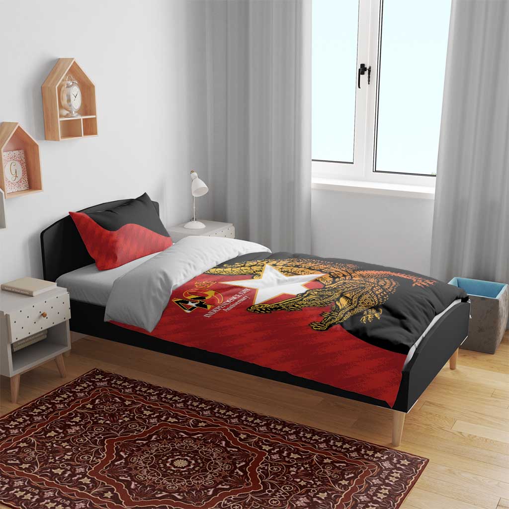 Red and black duvet cover and pillow shams featuring crocodile emblem on bed