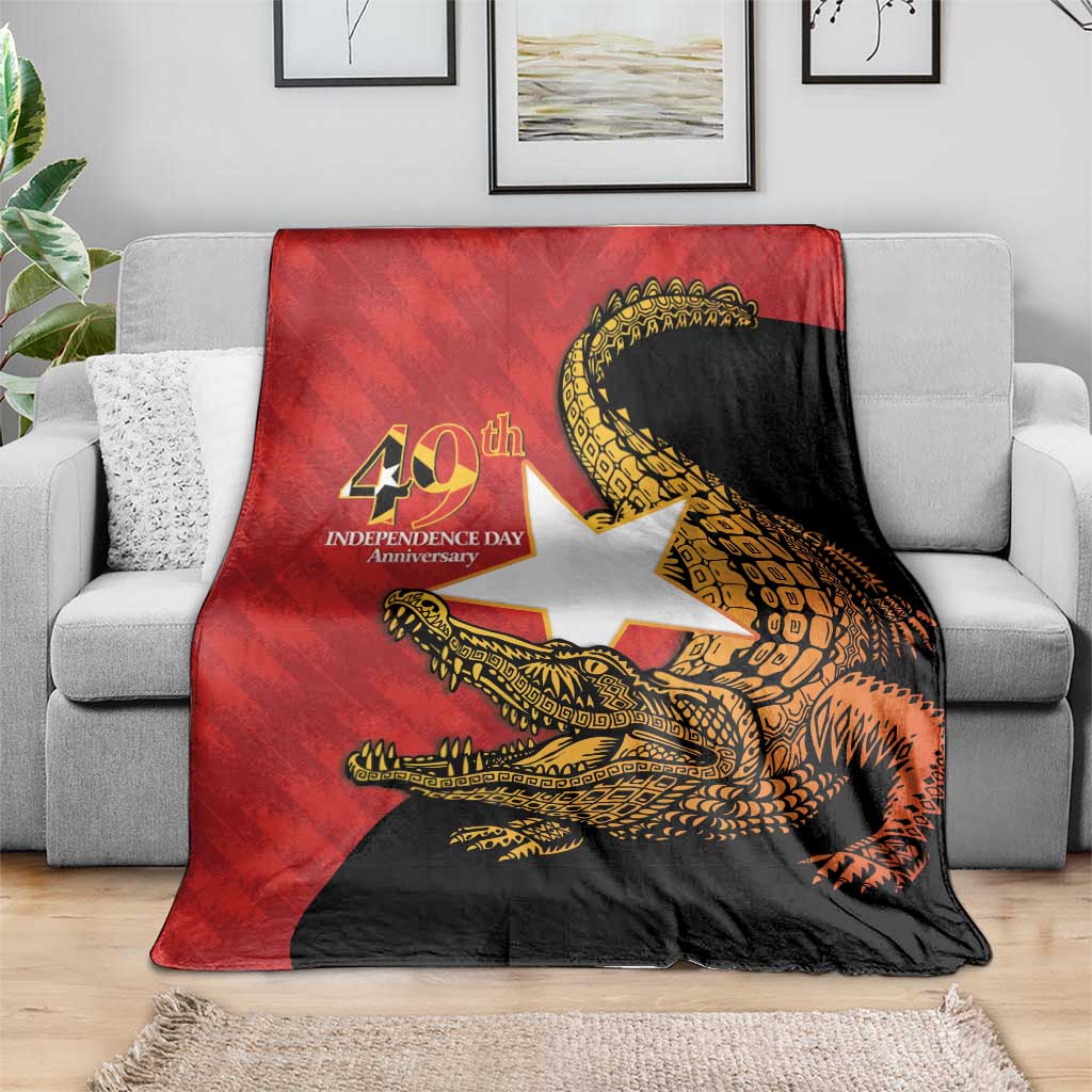 East Timor Independence Day blanket spread over sofa, red/black/white with gold crocodile