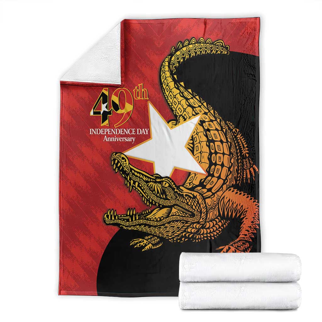 East Timor Independence Day blanket folded flat, red/white/black with gold crocodile graphic