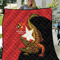 Red and black 40th anniversary quilt with quilted diamond pattern and golden crocodile emblem