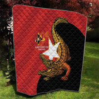 Red and black quilt blanket with quilted texture and golden crocodile emblem, 40th Independence Day