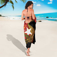 East Timor Independence Day sarong, black with red border and golden crocodile artwork