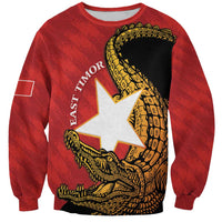 Dark red sweatshirt with large front graphic of crocodile and East Timor flag star
