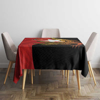 Black tablecloth with red top panel and gold crocodile motif with anniversary text