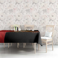 Black and red tablecloth with gold crocodile-themed design and angled corner drop