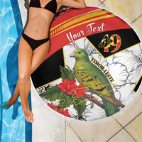 Round beach blanket with bird and hibiscus print, fringed edge, "Your Text" on red section