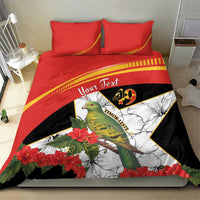Personalized bedding set on bed: red and black duvet with hibiscus, green bird and rays