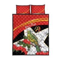 Red quilt bed set with two matching pillows, bird and hibiscus graphic, black border