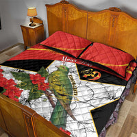 Red quilt bed set with two pillows, bird-and-flower print and 49 emblem, black trim