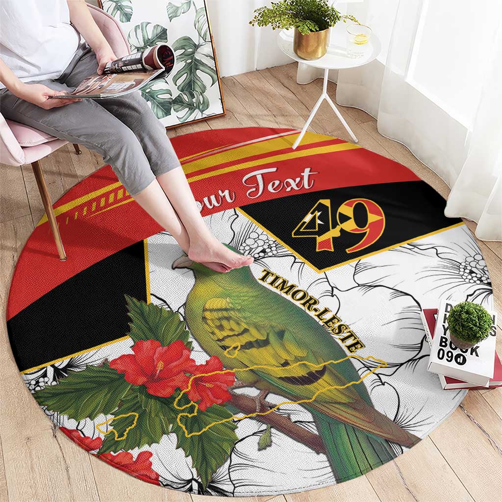 Round black, red, and white carpet with bird and hibiscus flowers, “Your Text” centered
