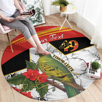 Round black, red, and white carpet with bird and hibiscus flowers, “Your Text” centered