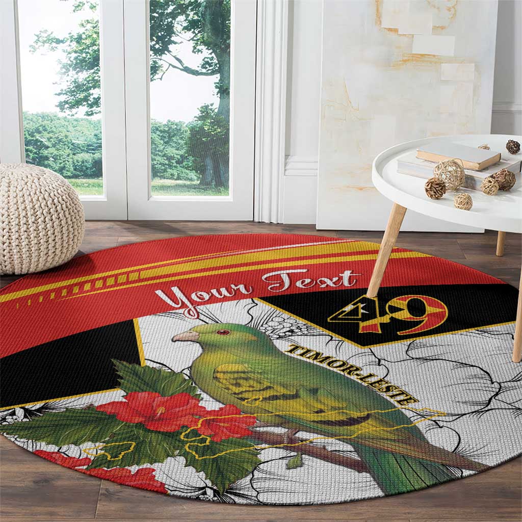 Round black, red, and white carpet with bird and flowers, “Your Text” across center
