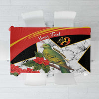 Red, black, and white patterned tablecloth with bird and hibiscus flowers