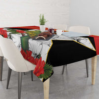 Red, black, and white tablecloth with bird, hibiscus flowers, and leaf pattern