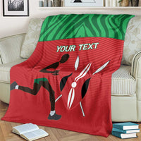 Red and green athletics blanket draped on beige armchair, 'YOUR TEXT' and runner icons