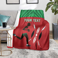 Red and green athletics blanket on the floor over a rug, with 'YOUR TEXT' and silhouettes