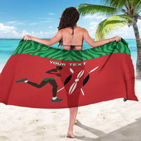 Red and green runner sarong with custom text, draped over shoulders from back