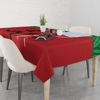 Red tablecloth with draped corner, green edge trim, and sports-themed graphic design