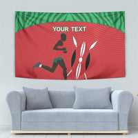 Red and green runner tapestry with 'YOUR TEXT' and silhouette figures, above sofa