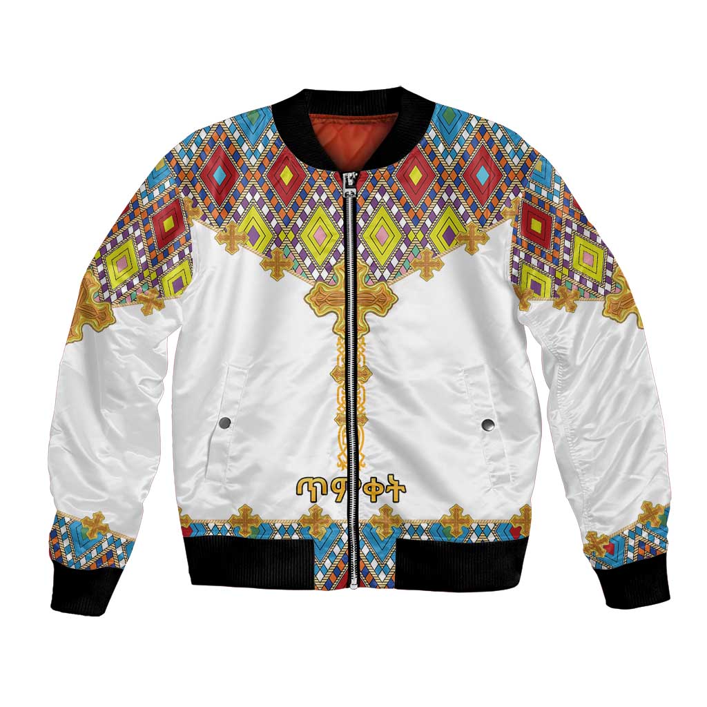 White unisex bomber jacket with Ethiopian-style cross and diamond pattern, zip front