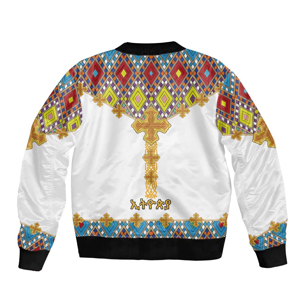 White unisex bomber jacket with large gold cross graphic and multicolor geometric pattern