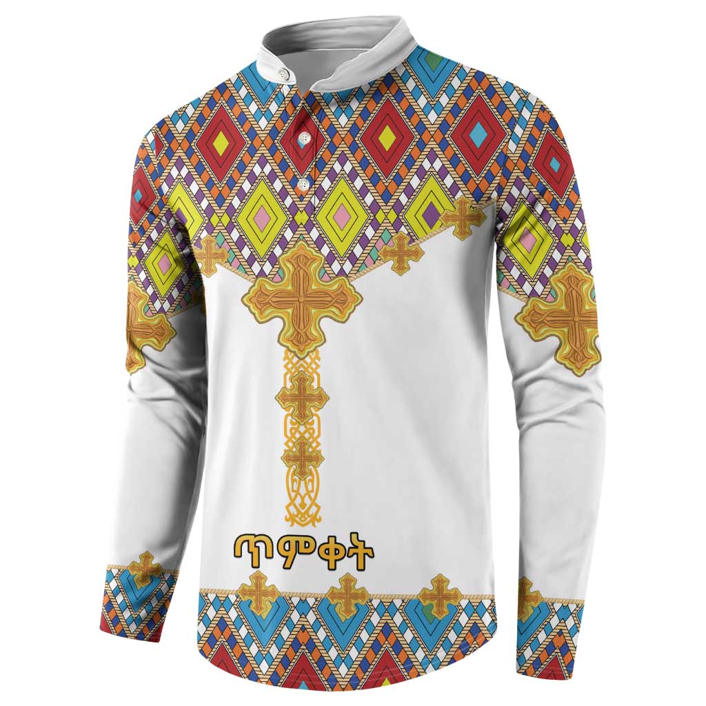 White button sweatshirt with diamond pattern, gold cross front, and long sleeves