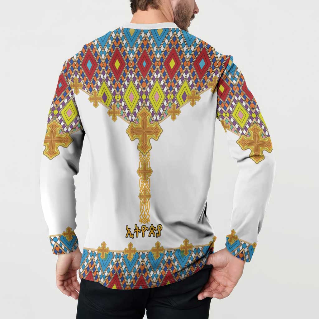 White button sweatshirt with diamond pattern and gold cross on back, long sleeves