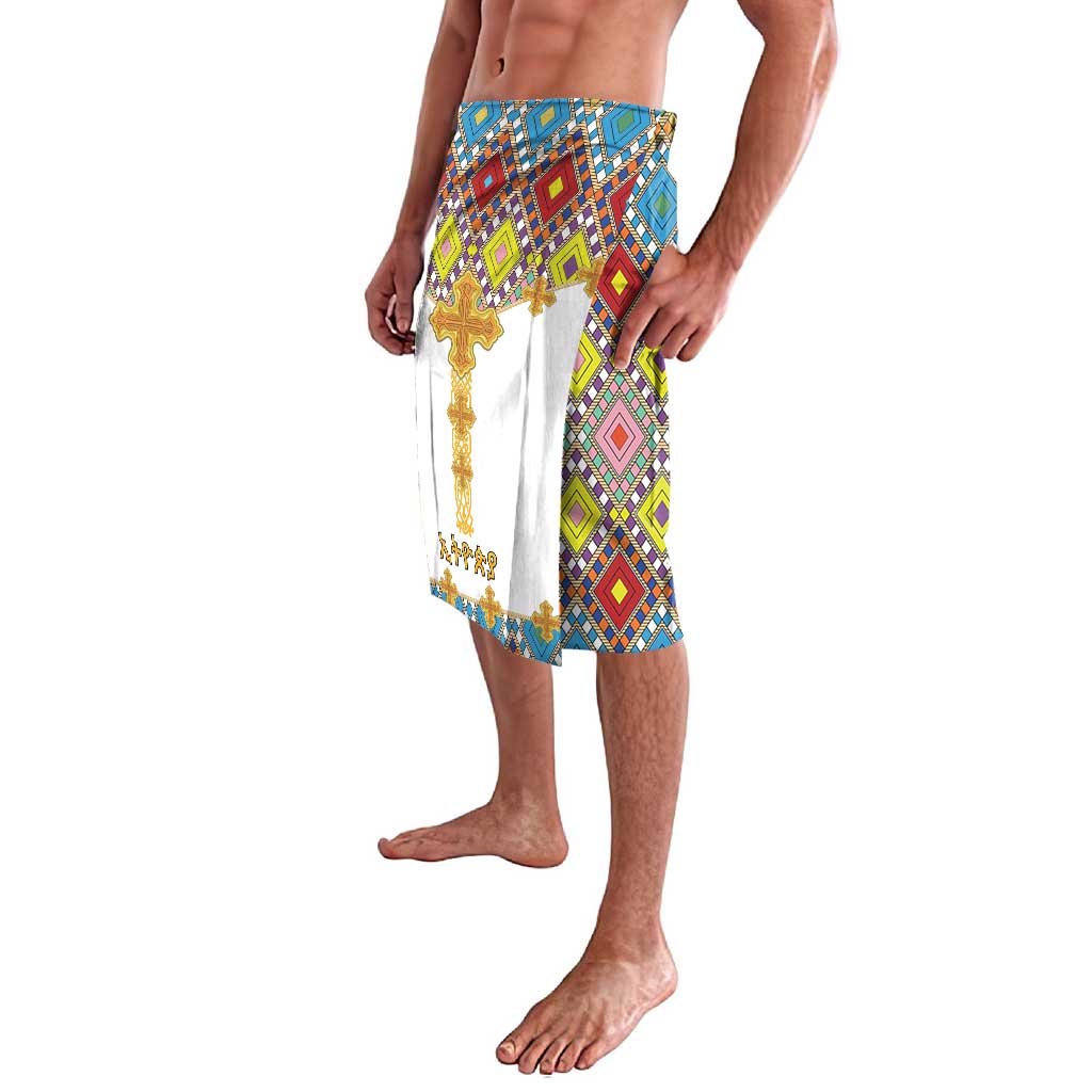 Tile-pattern sarong-style lavalava with gold cross detail and front fringe