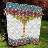 White quilt with diamond tile pattern border, large gold cross in the center, quilted texture