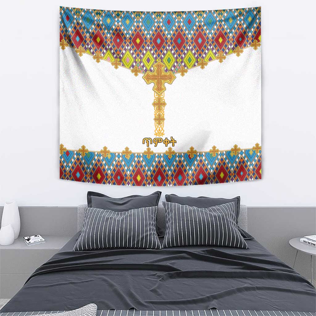 Wall tapestry featuring a golden cross over white fabric with multicolor geometric bands