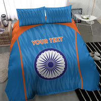 Blue bedding set with orange frame lines, circular India emblem, and two pillowcases